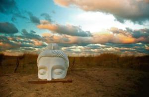 White buddha sculpture in the dunes and sand prairie of Loyola Park in Rogers Park